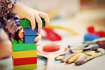 Child assembling toy bricks