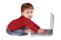 Toddler playing with a computer